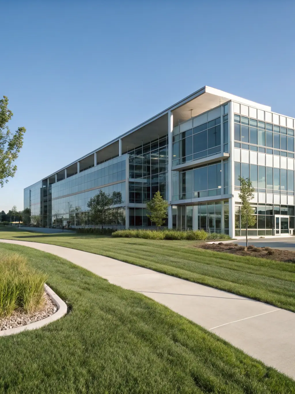 A well-maintained commercial building exterior with clean windows and tidy landscaping, showcasing Inspire Home Repair's commitment to property upkeep.